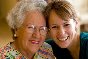 Happy grandmother with nurse