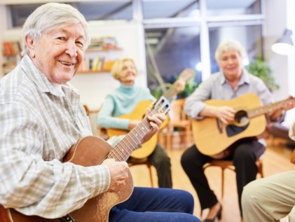 Group music session showcasing the benefits of music therapy for seniors.